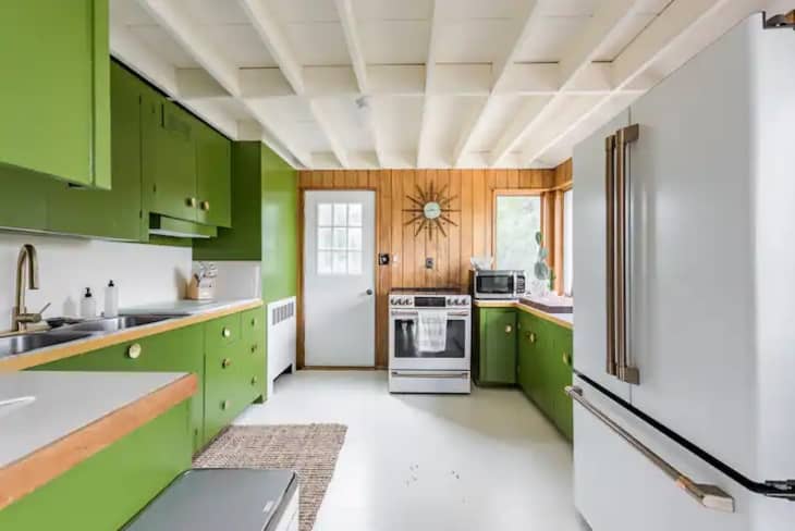 Kitchen with bright green cabinets