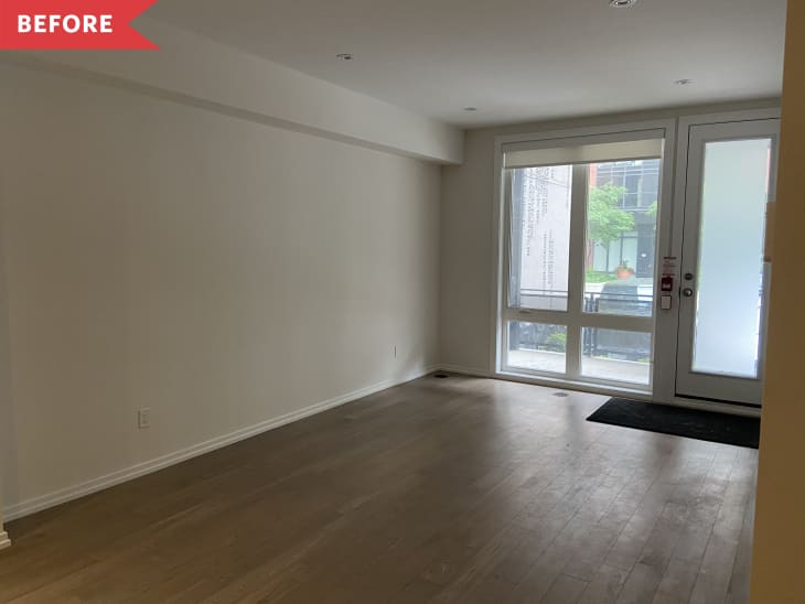Before: Empty room with large windows