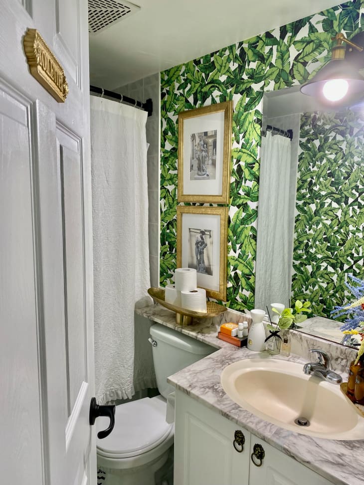 Bathroom with tropical wallpaper