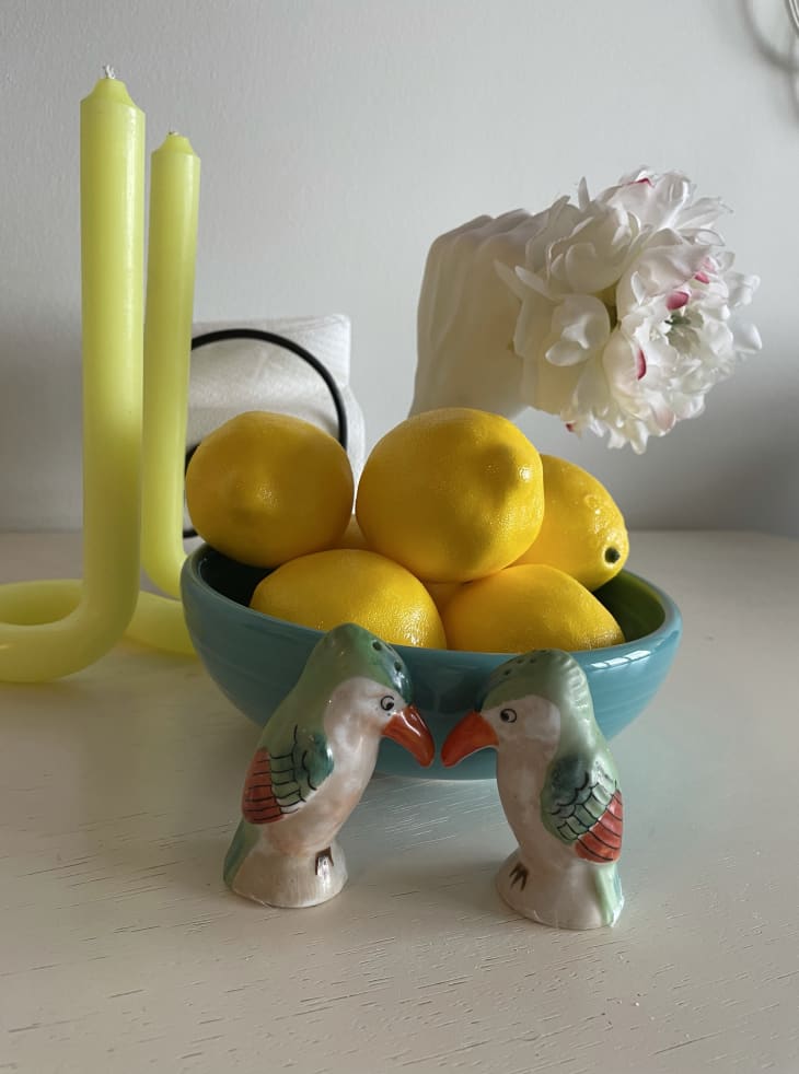 Bowl holding lemons and twist candles
