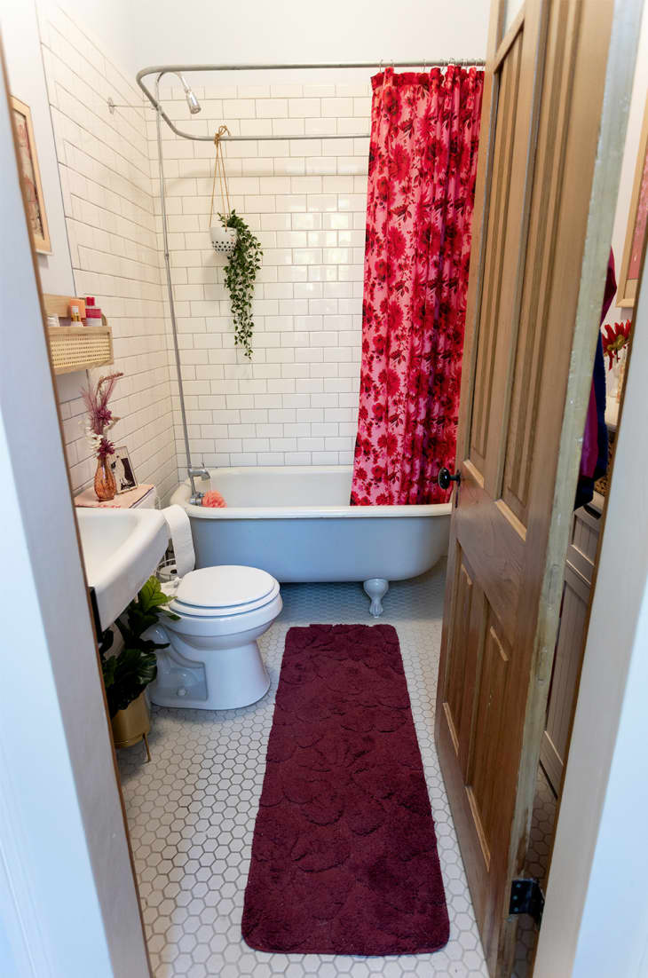 Bathroom with red shower curtain