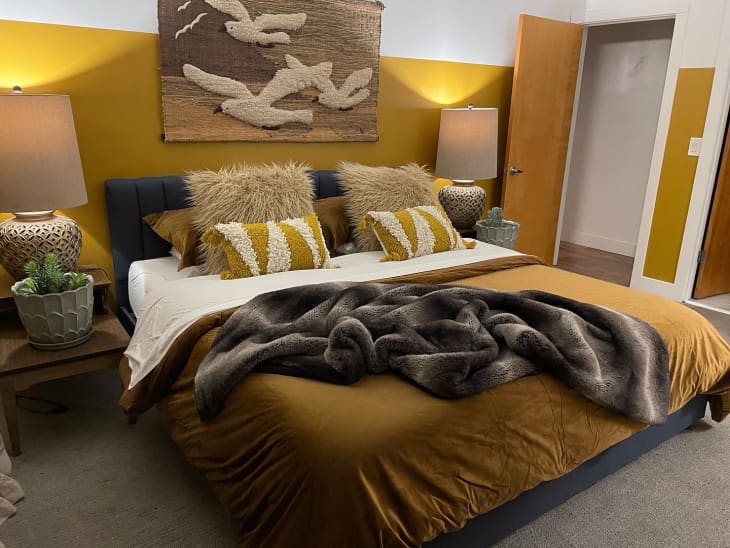 bed with golden duvet