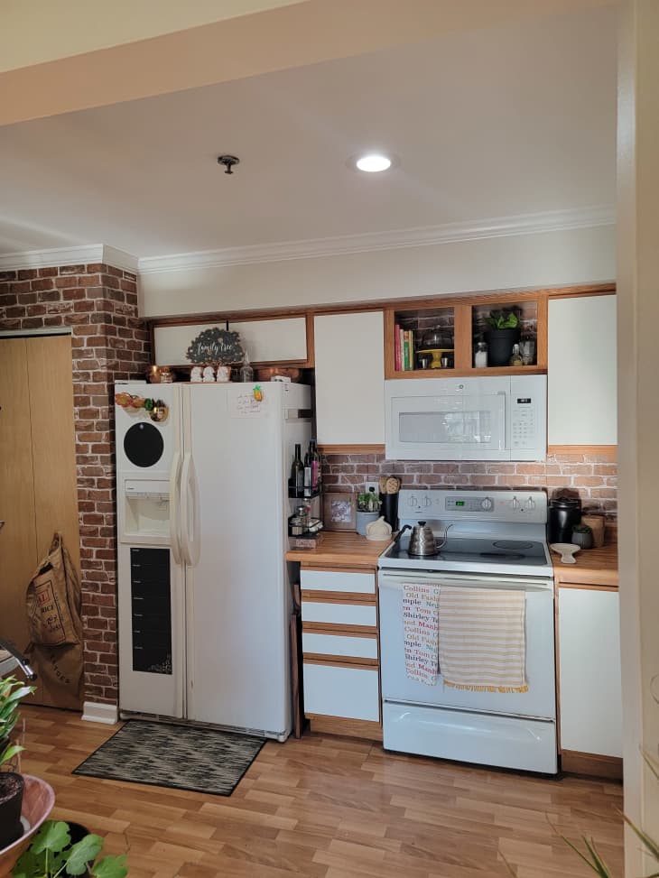 Kitchen with brick wall