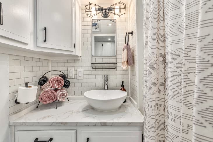 White bathroom sink with roses