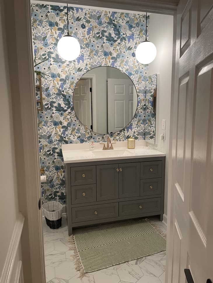 Bathroom with blue floral wallpaper