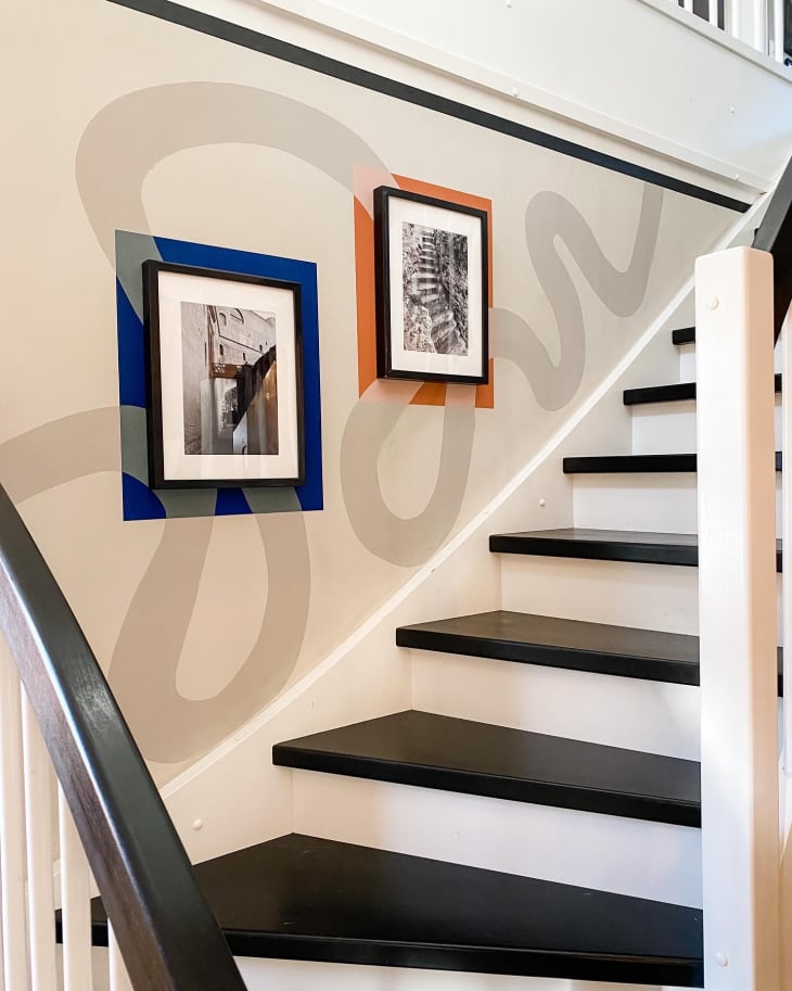 staircase with photos on wall