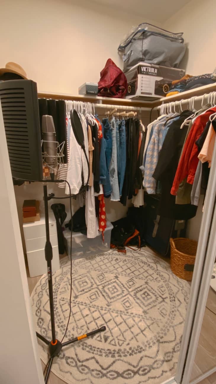 Closet space with a rug and recording equipment