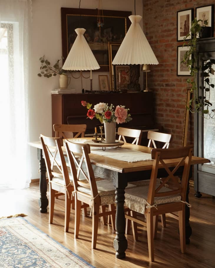 Dining room with wooden table and wooden chairs