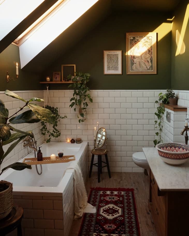 Bathroom with white tile on bottom of walls and green top of walls
