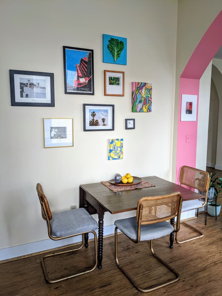 Dining table next to gallery wall