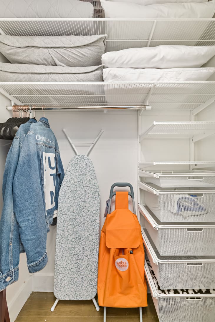 Laundry room with pillows and ironing board