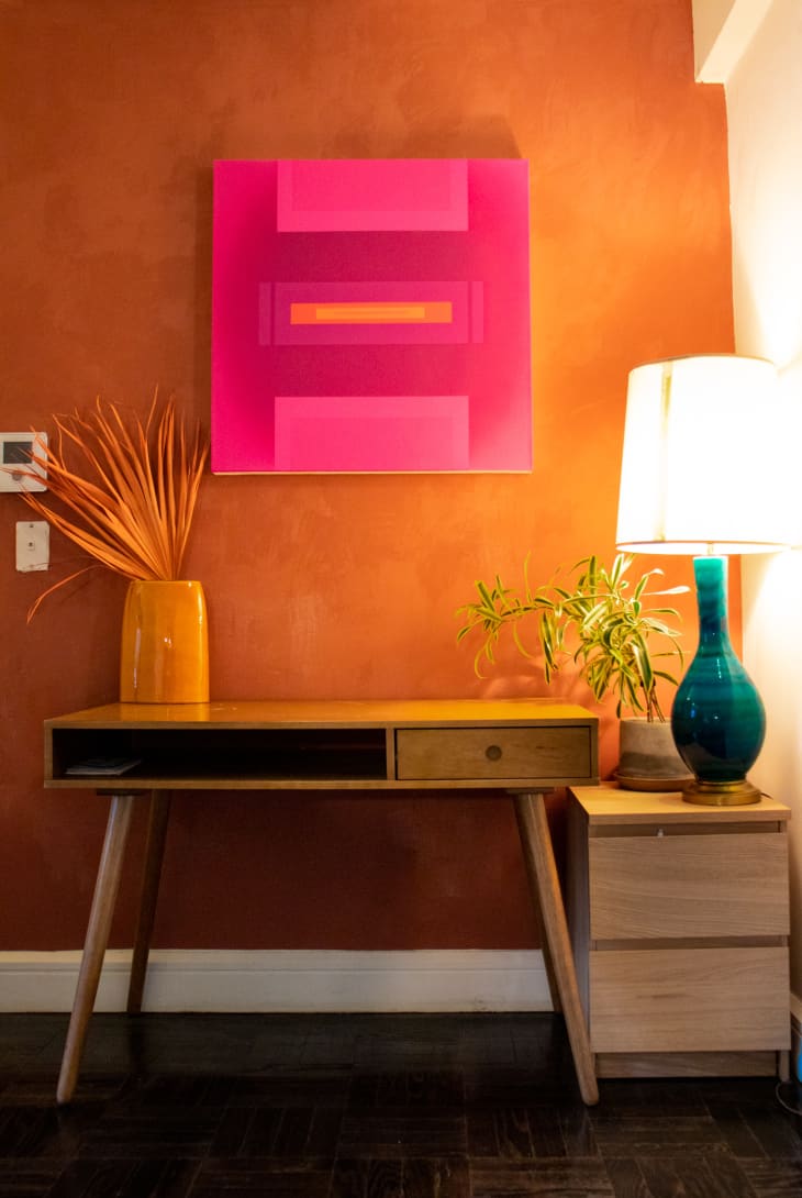 Desk in front of orange wall