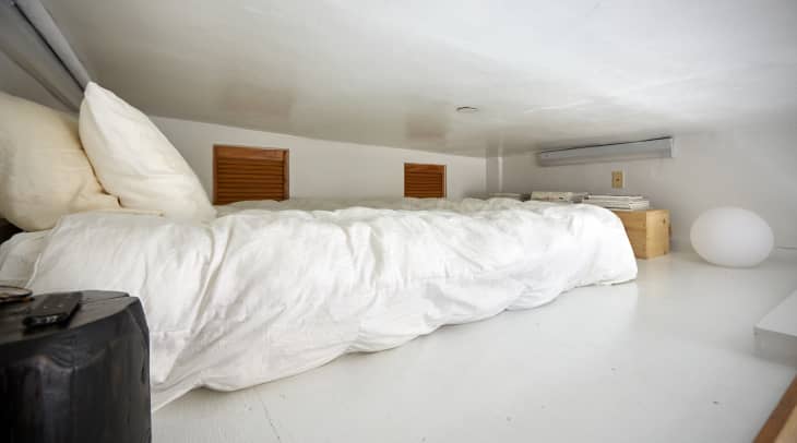 All white tiny loft bedroom
