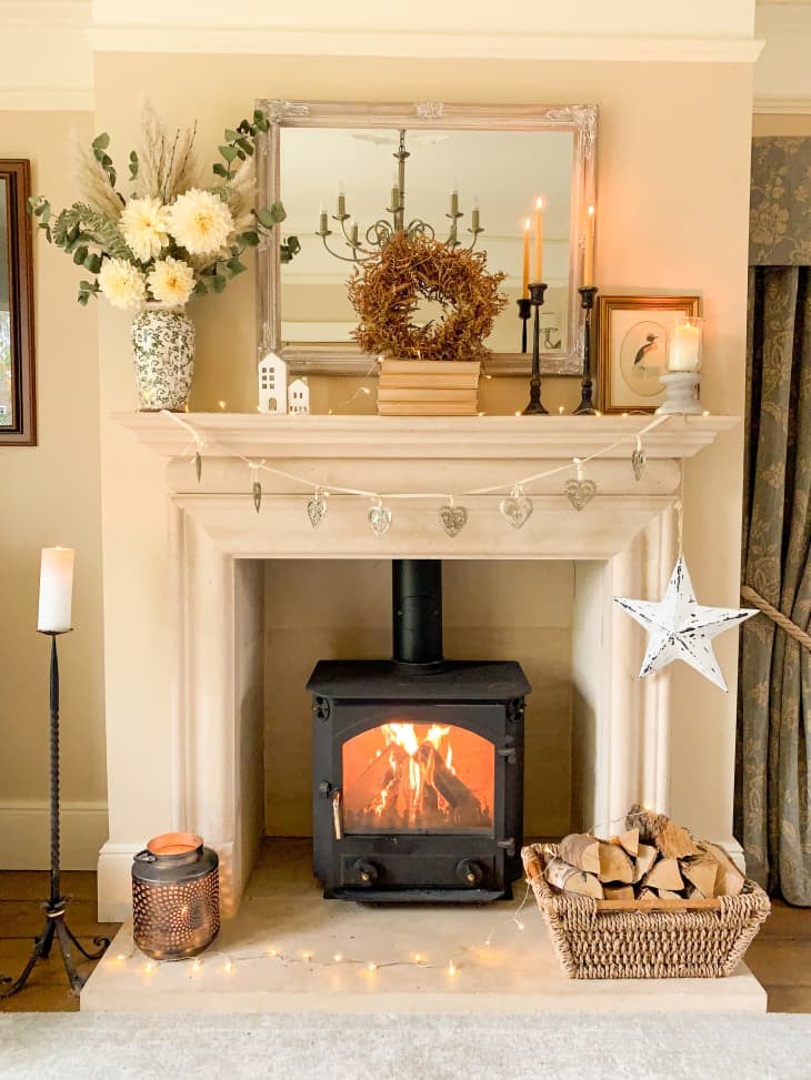 White fireplace with flowers on the mantle