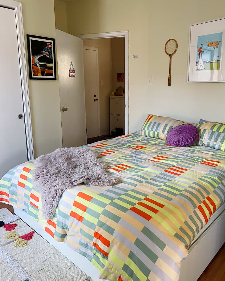 Bedroom with multi-colored striped bed