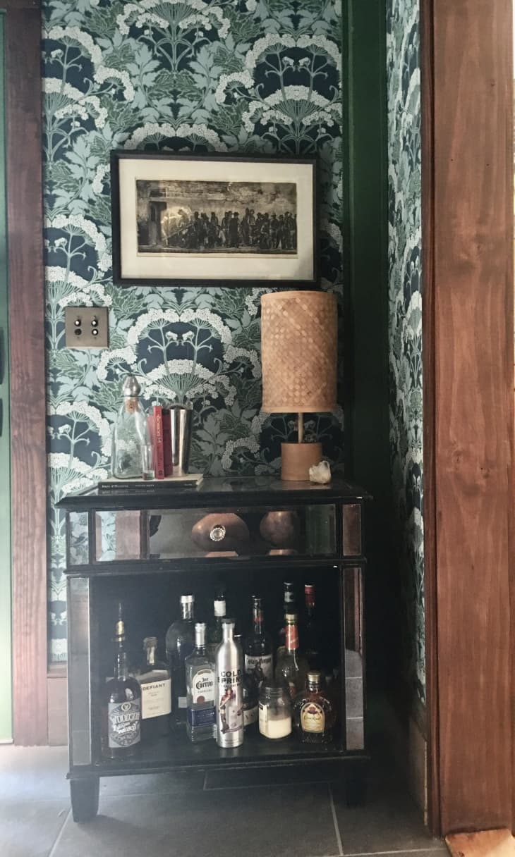 Bar cart in front of blue and white wallpaper