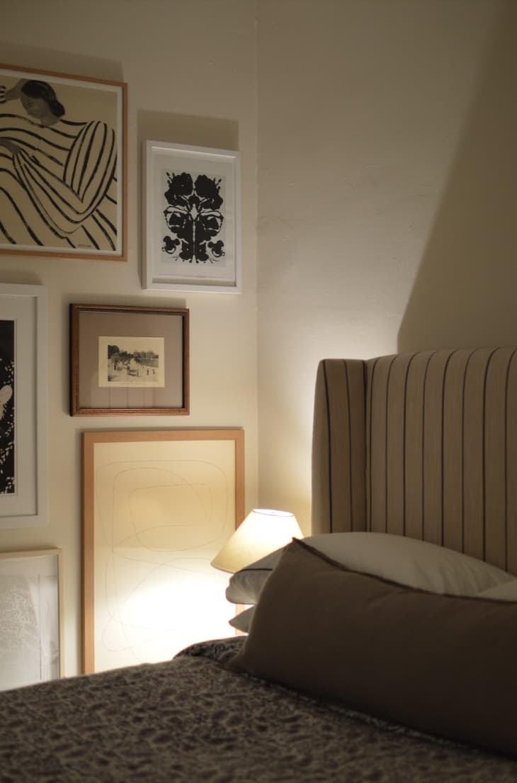 Bedroom with a gallery wall on the side wall