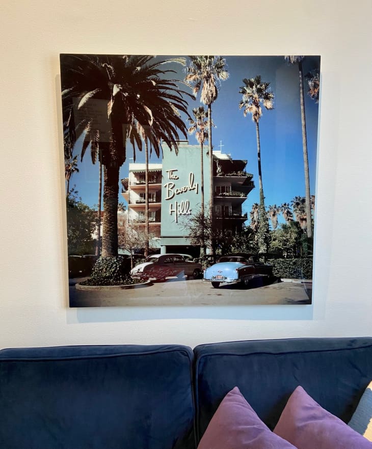 A photograph of The Beverly Hills Hotel above a blue sofa