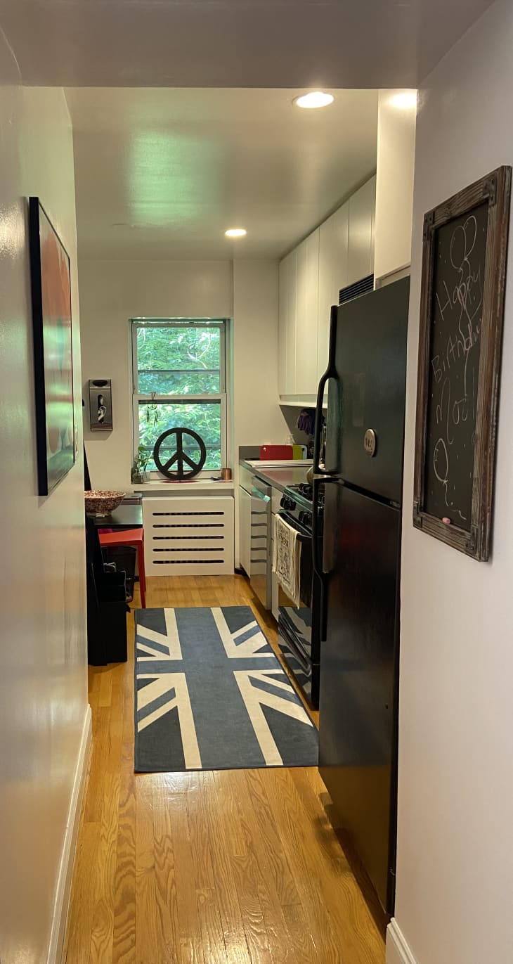 Hallway into kitchen with a blue UK flag rug