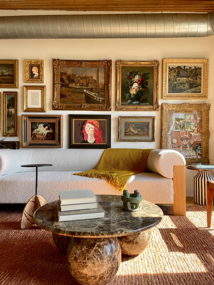 A framed gallery wall above a couch