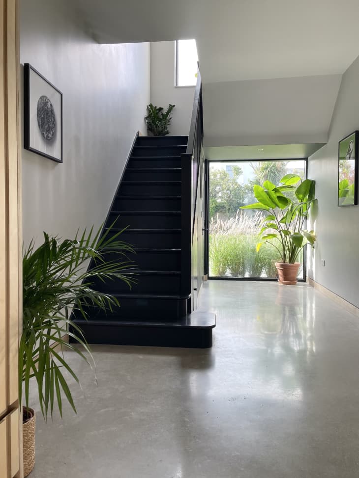 A black staircase and white walls
