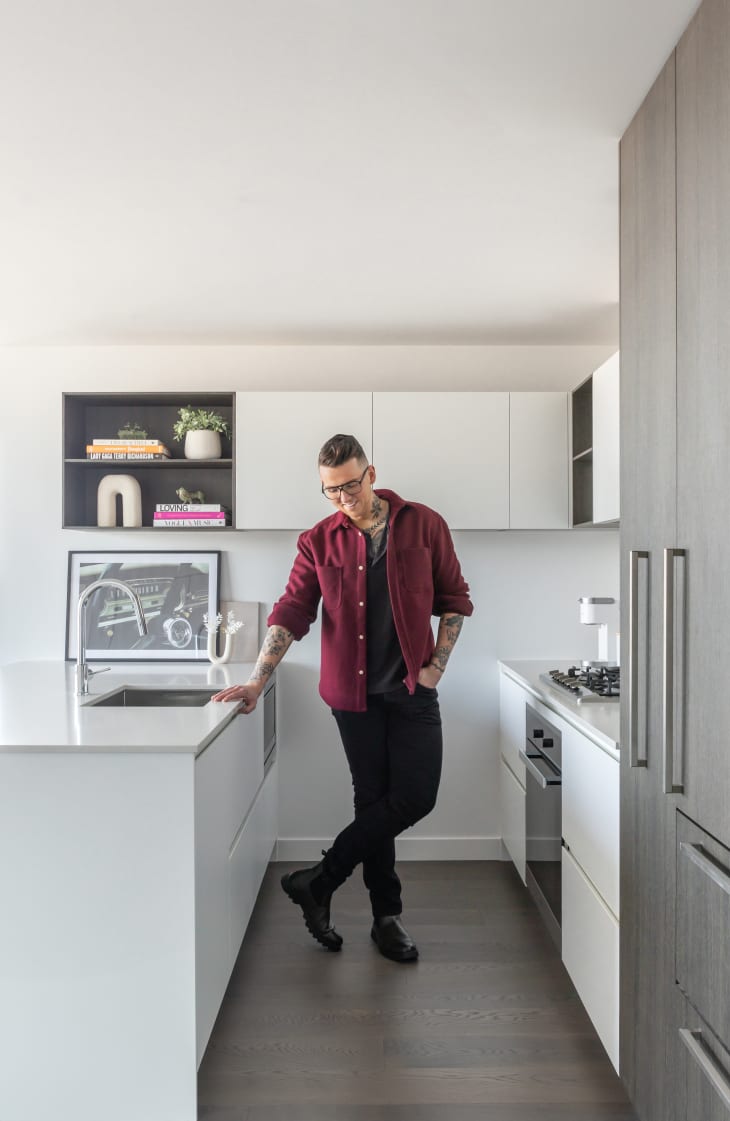 Dweller standing in small white galley kitchen