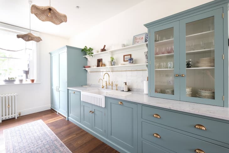 Blue cabinets with newly renovated kitchen.