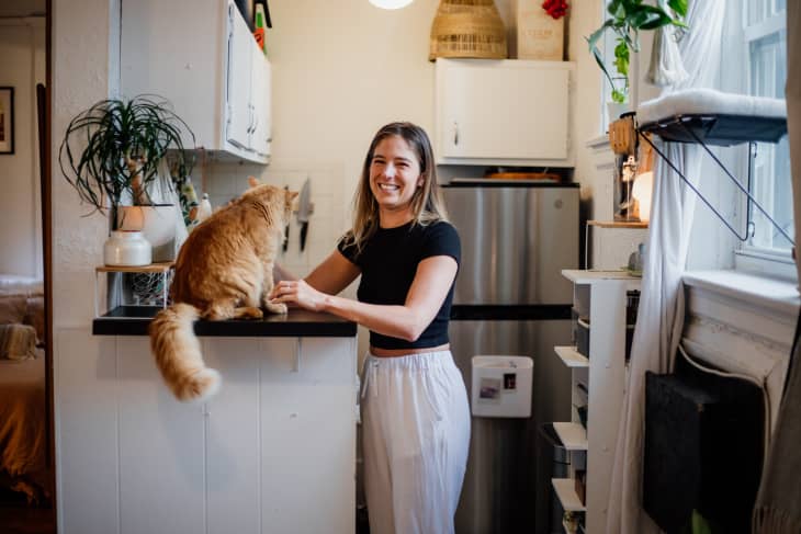 woman in kitchen with her cat