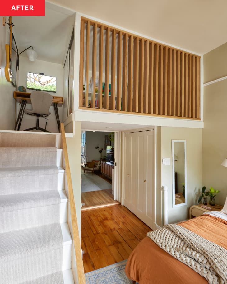 view from below of white loft nursery space and small workspace with wood railings