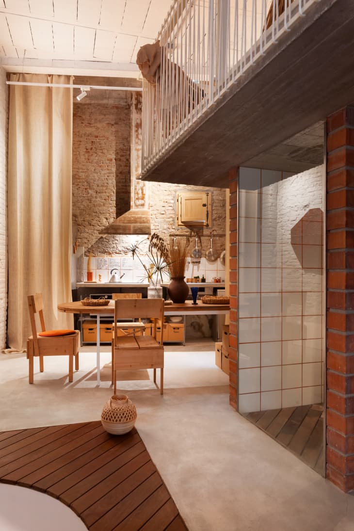 Dining room and kitchen of brick loft apartment