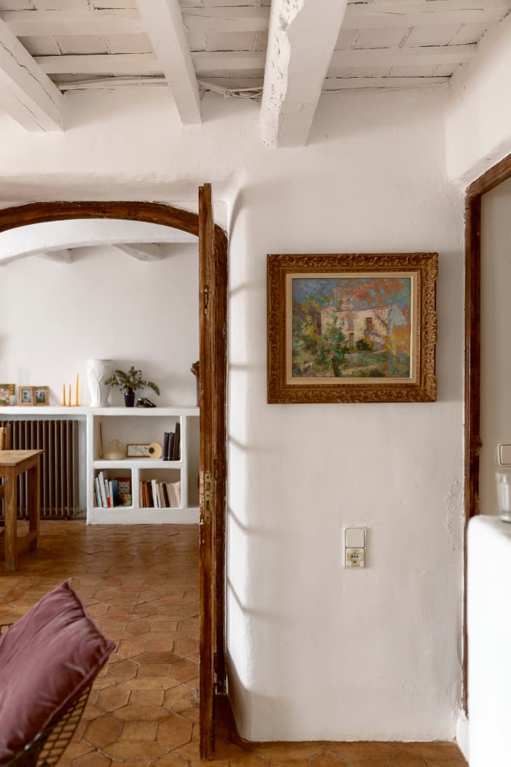 Landscape painting hung on wall in Barcelona home.