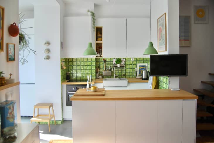 Green tile backsplash in newly renovated kitchen.