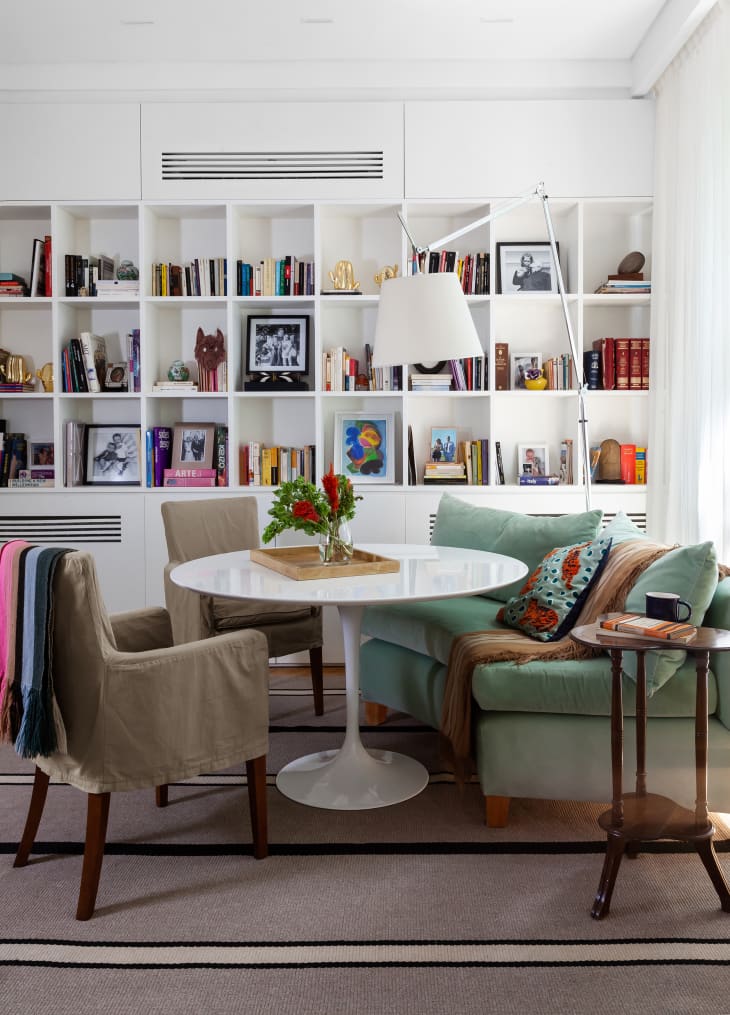 Buenos Aires, Argentina house tour, sitting area/reading nook. Tall bookshelves on wall behind