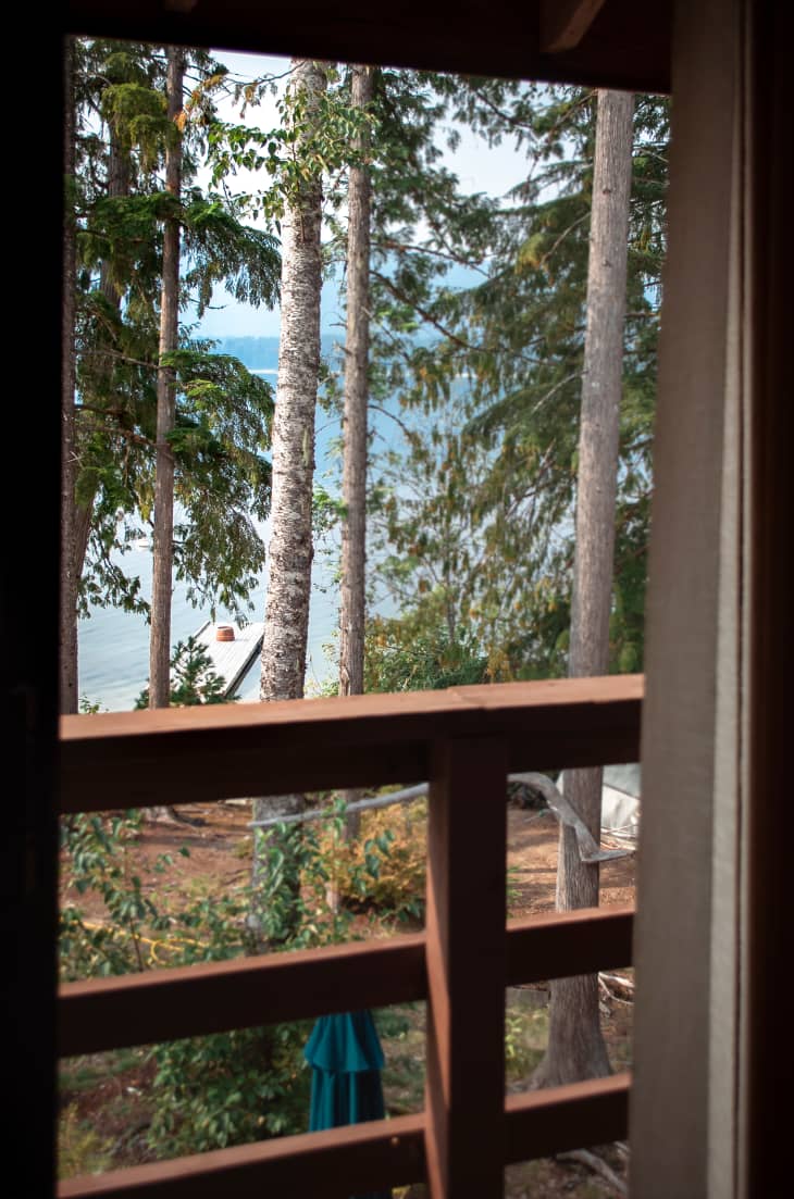 view of lake and trees from bedroom