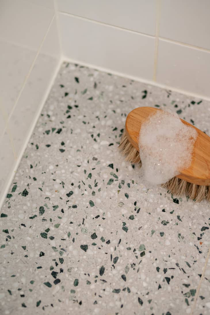 Soapy body brush in shower.