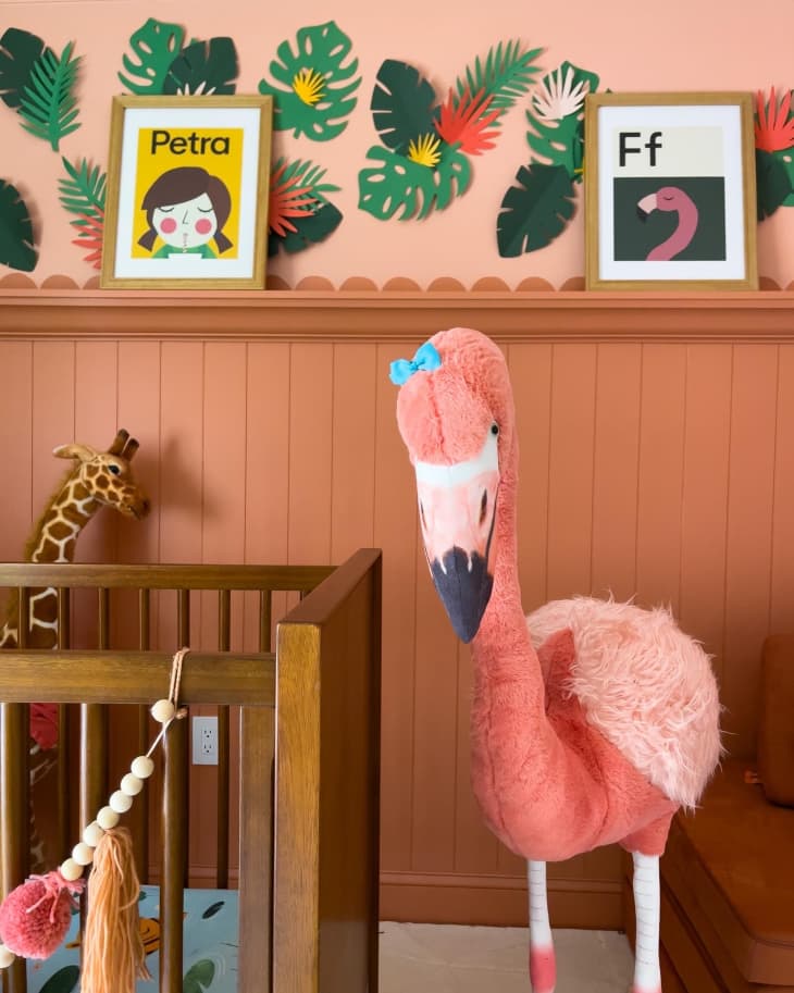 A large stuffed flamingo in the a renovated nursery.