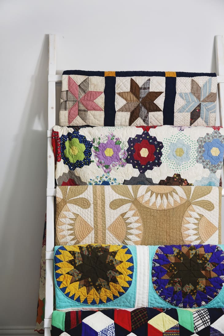 storage ladder/rack with multiple colorful quilts