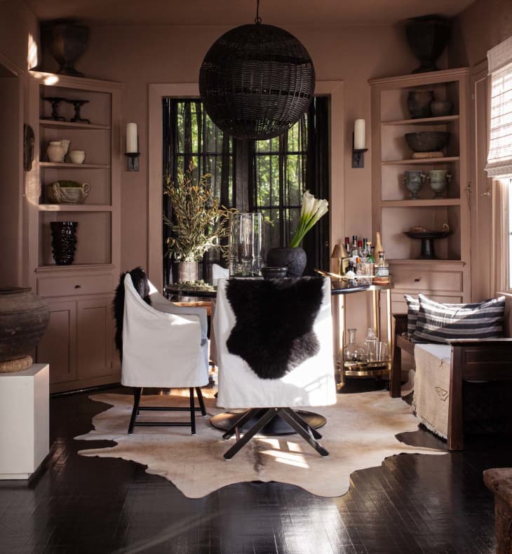 Apartment with white walls, black and brown accents - dining room