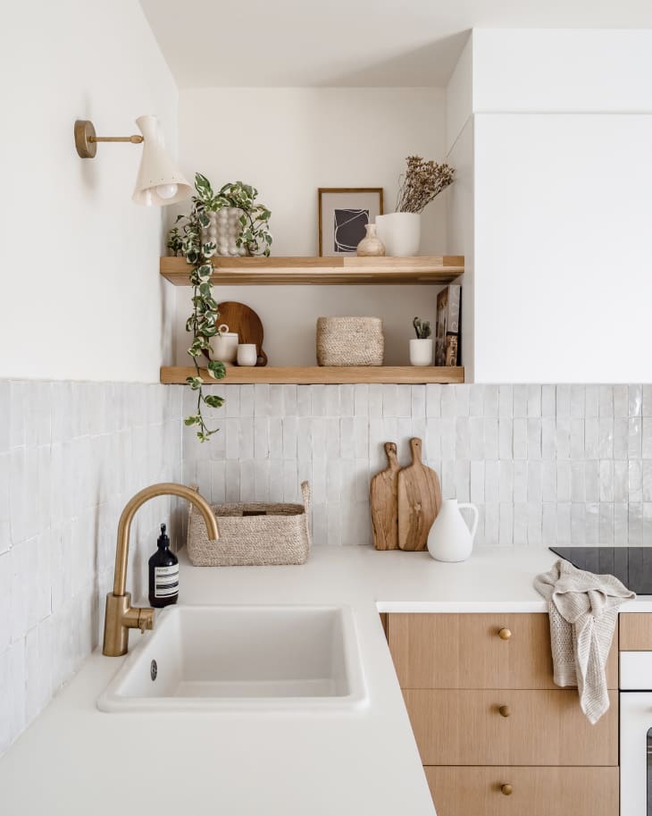 Apartment kitchen with lots of white, natural wood, natural colors, natural fiber textiles