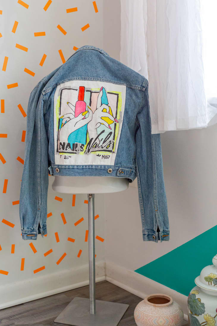 Jean jacket with handmade painting on back on dress form