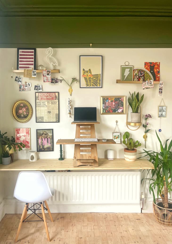 office/desk area with green and white painted walls, lots of art/gallery wall