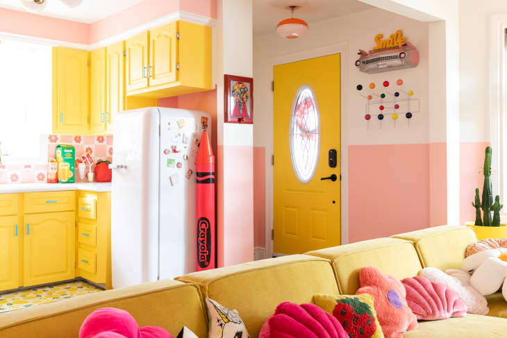 Yellow exterior door in colorful vintage inspired home.
