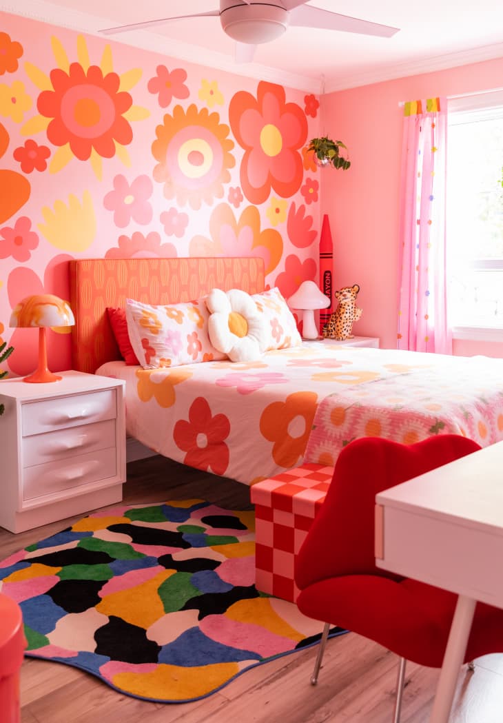 Pink, orange and yellow wall decal in colorful bedroom.