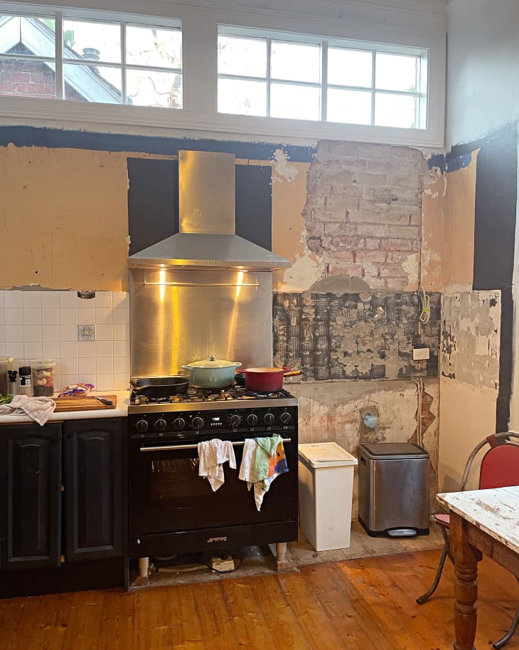 Exposed brick in kitchen during renovation.
