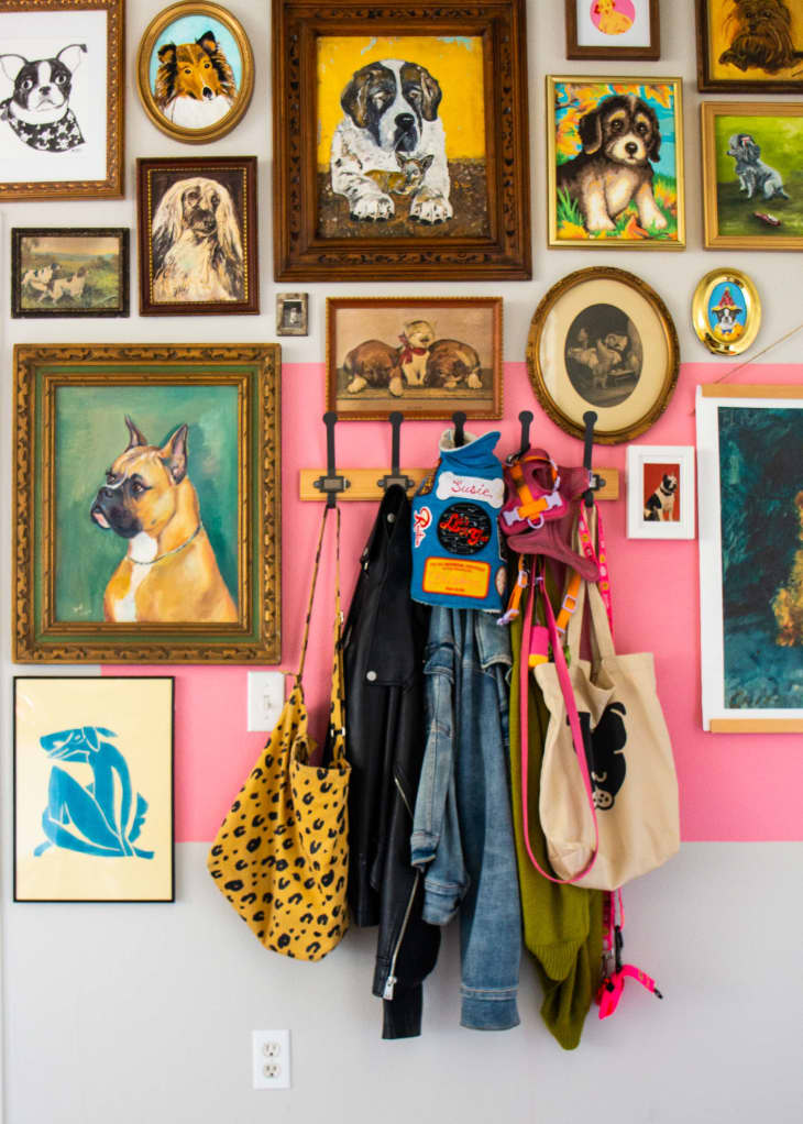 A gallery wall with items hanging on hooks