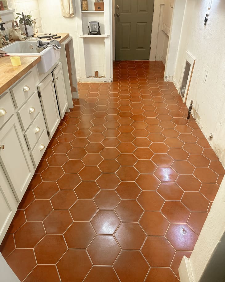 Hexagon terra cotta tiles in kitchen during renovation.