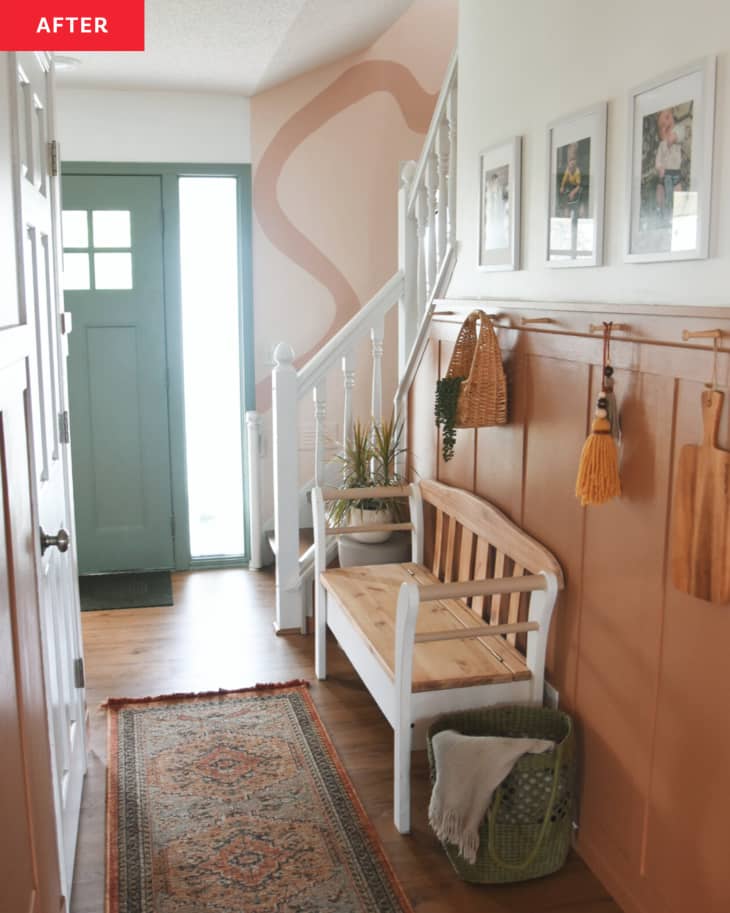 white and terracotta hallway with wood and white bench and view of blush stairway area after renovation