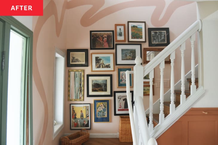 stairway with pale blush wall paint designs and gallery wall after renovation