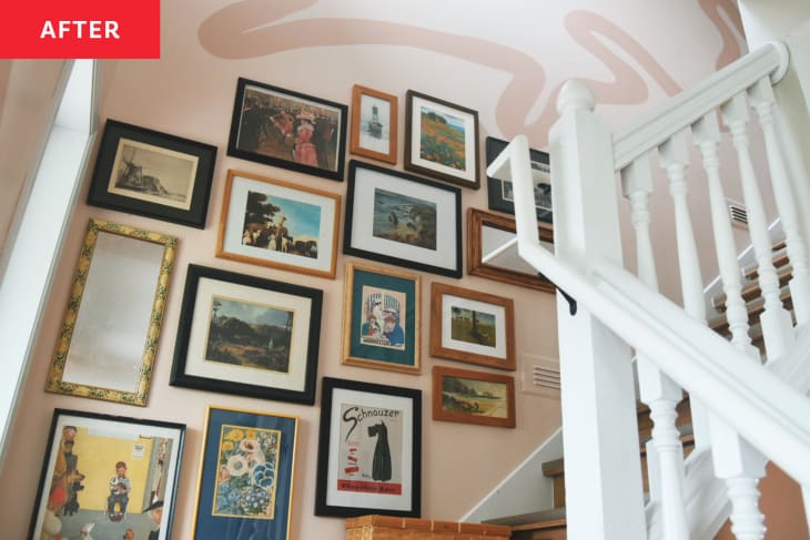 stairway with pale blush wall paint designs and gallery wall after renovation