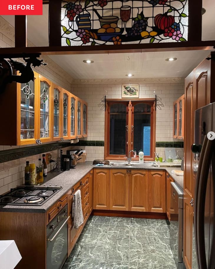 80s style kitchen with wood cabinets and stained glass cabinet doors before remodel